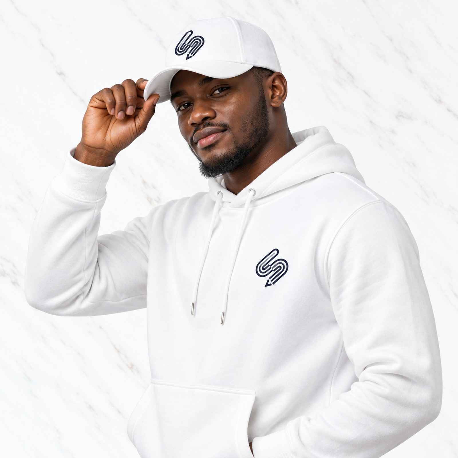 Model wearing a Ventura Visuals branded hoodie and cap
