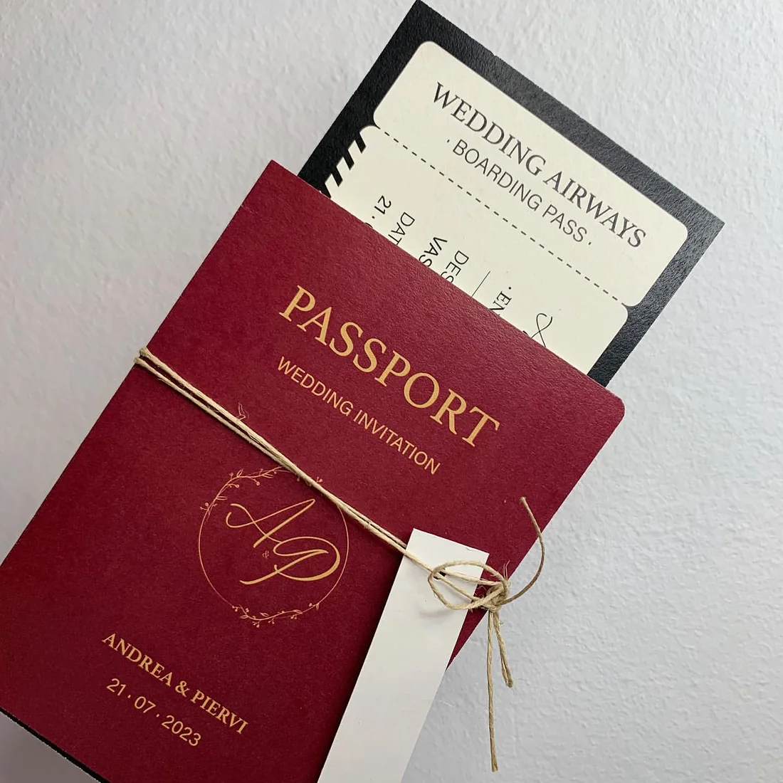 Burgundy passport wedding invitation with gold foil lettering
