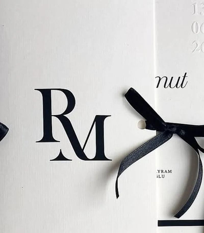 Real blind-embossed wedding invitation produced by Wedding Cards Uganda