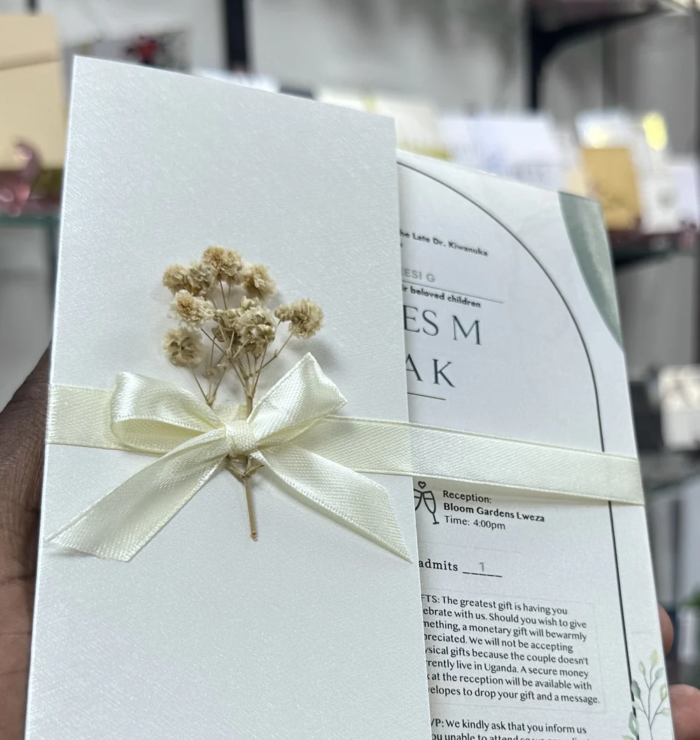 Ivory floral invitation with ribbon detail
