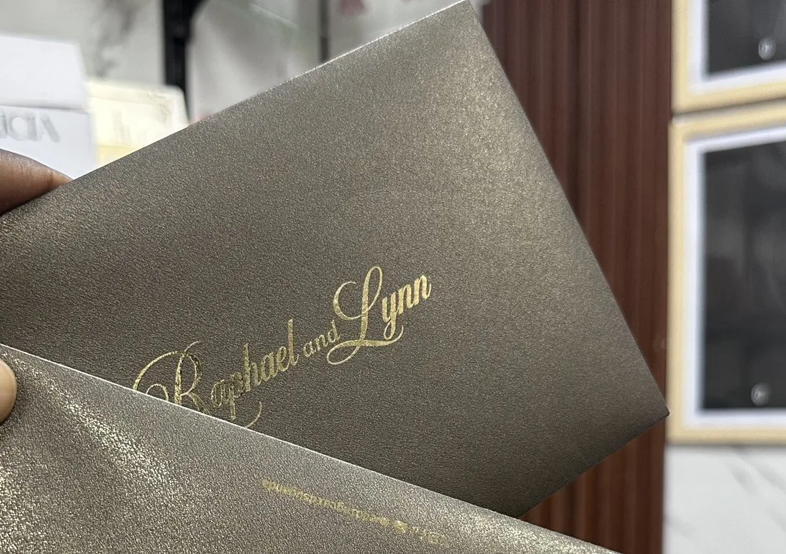 Metallic taupe invitation with foil lettering